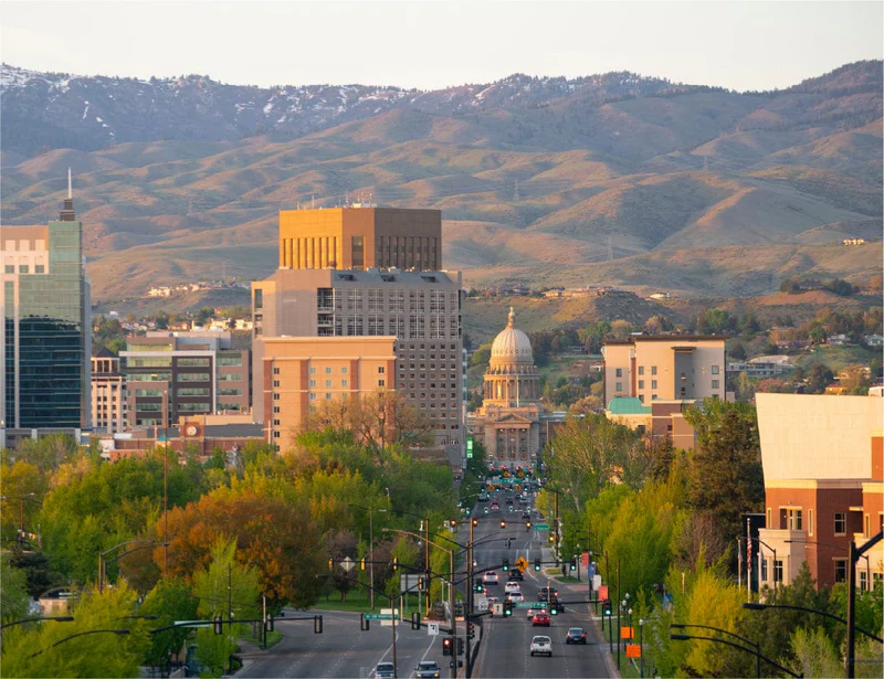 Modern interior with armchair, wood slat wall, and bar cart